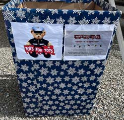 Corn Hole Fundraiser Toys for Tots collection box.